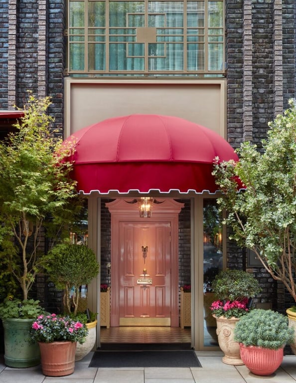 Broadwick Soho entrance — pink door under the red awning